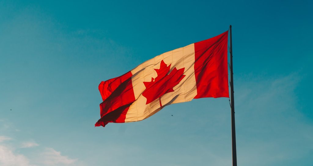 Canadian flag flying outdoors representing Canadian citizenship