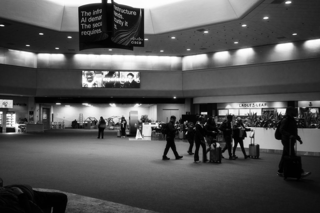 International travellers with luggage in a modern airport terminal